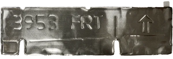 a Thermapatch™ peel-and-stick heat shield - 1 A flexible, peel-and-stick heat shield with a part number stamped onto it