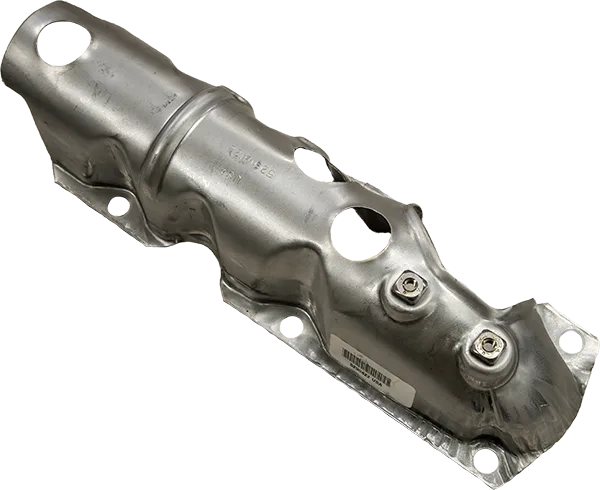 An assembled component including a heat shield with built-in rivets and bar code An assembled component including a heat shield with built-in rivets and bar code