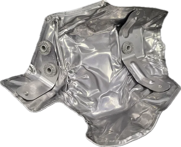 An assembly of a stamped heat shield with rivets and brackets added Stamped heat shield with rivets and brackets added – a good example of Soundwich's assembly capabilities.