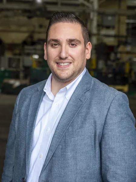 Alex Papadopulos- Soundwich Chief Executive Officer & President Alex Papadopulos is Soundwich's Chief Executive Officer and President. He has short dark brown hair and a short beard and mustache. Alex is wearing a white button-down shirt and a medium-blue jacket.