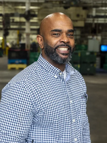 Brandon Towns, Soundwich's Saint Clair Plant Manager. Brandon Towns is Soundwich's Saint Clair Plant Manager. He has a black beard and mustache and is wearing a blue and white checked shirt.